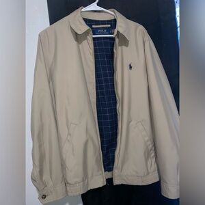 Selling a polo Jacket, size small , a tan color.